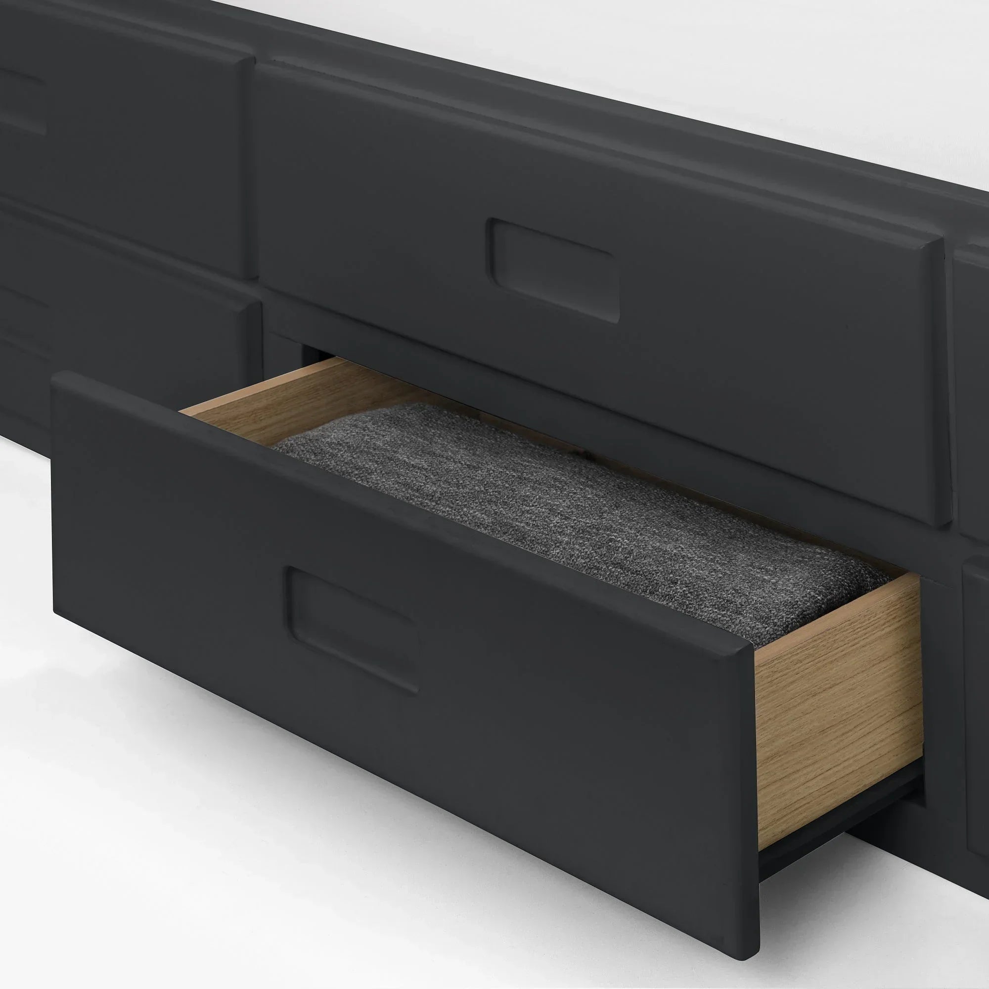 Maisie single daybed in anthracite with open storage drawer showing folded blanket inside