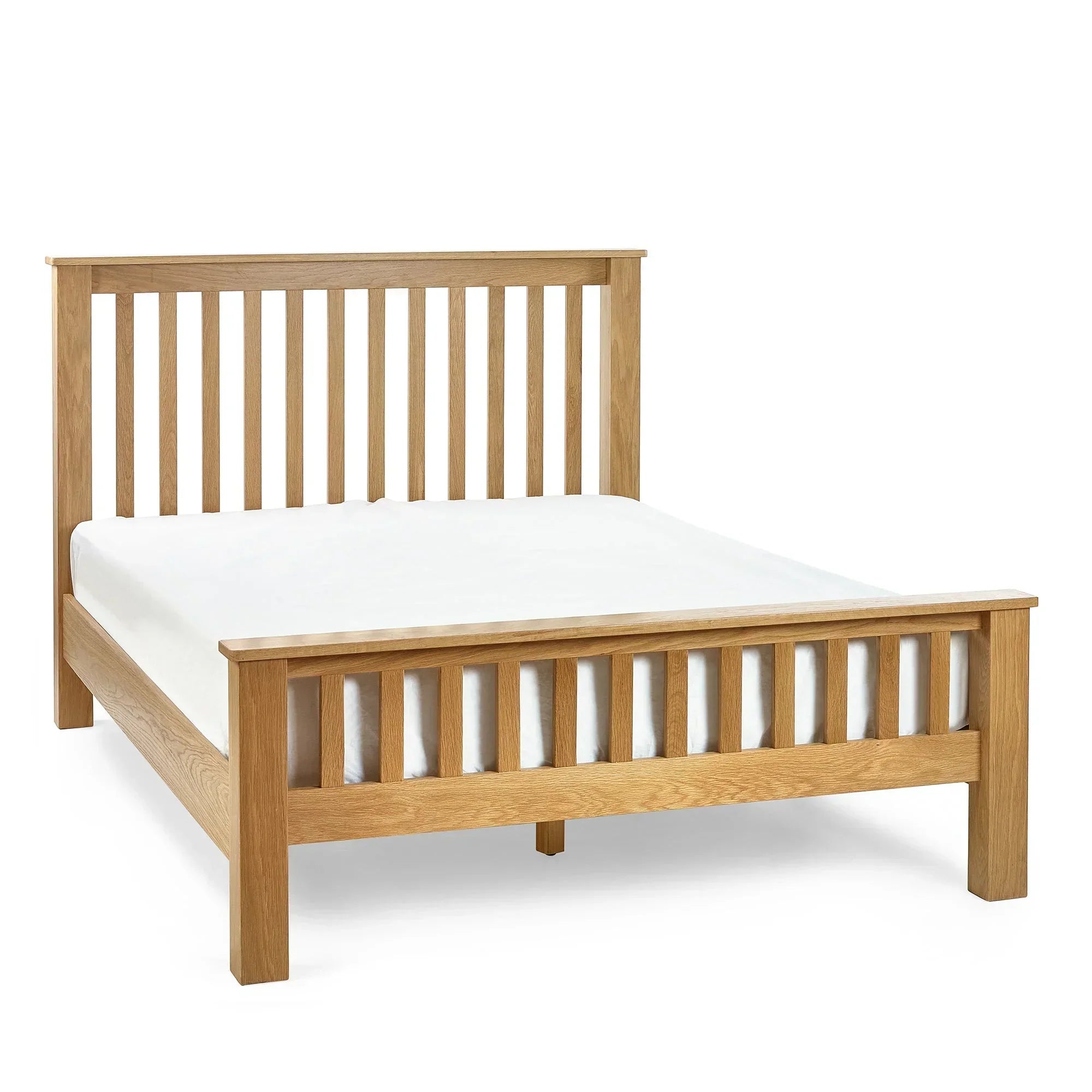 oak double bed frame with slatted headboard and footboard, mattress displayed, white background