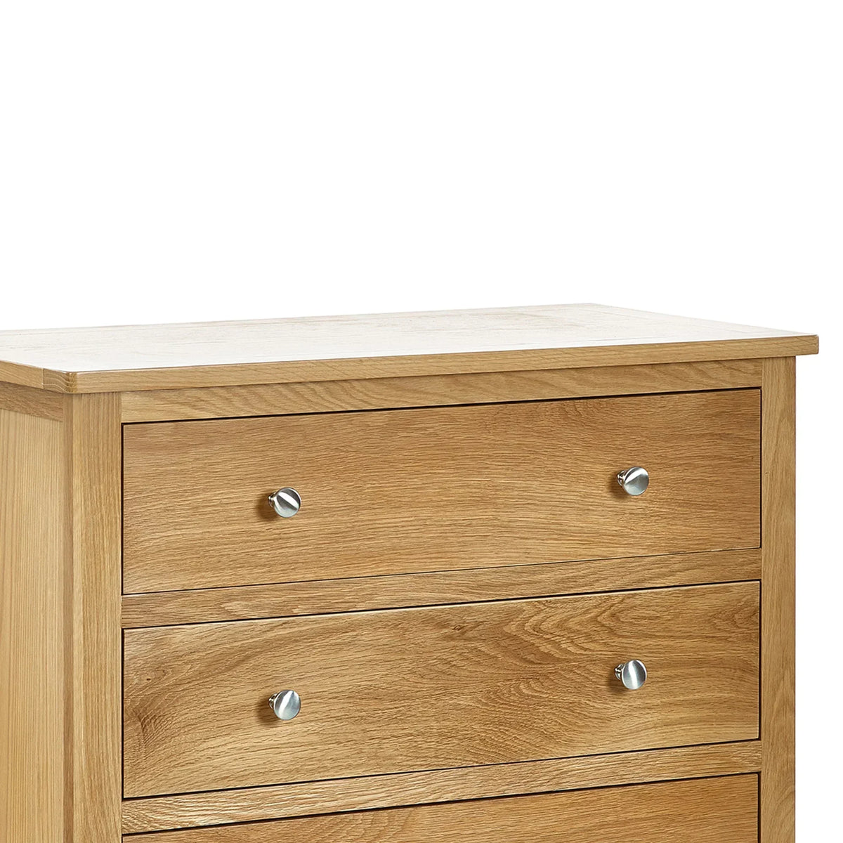 Oak 4 drawer chest detail with silver knobs and wood grain texture