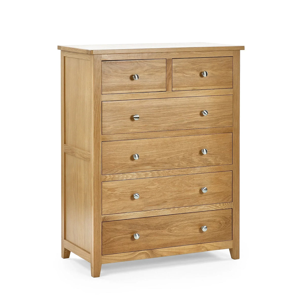 Oak chest of drawers with six drawers and silver handles, angled view on white background
