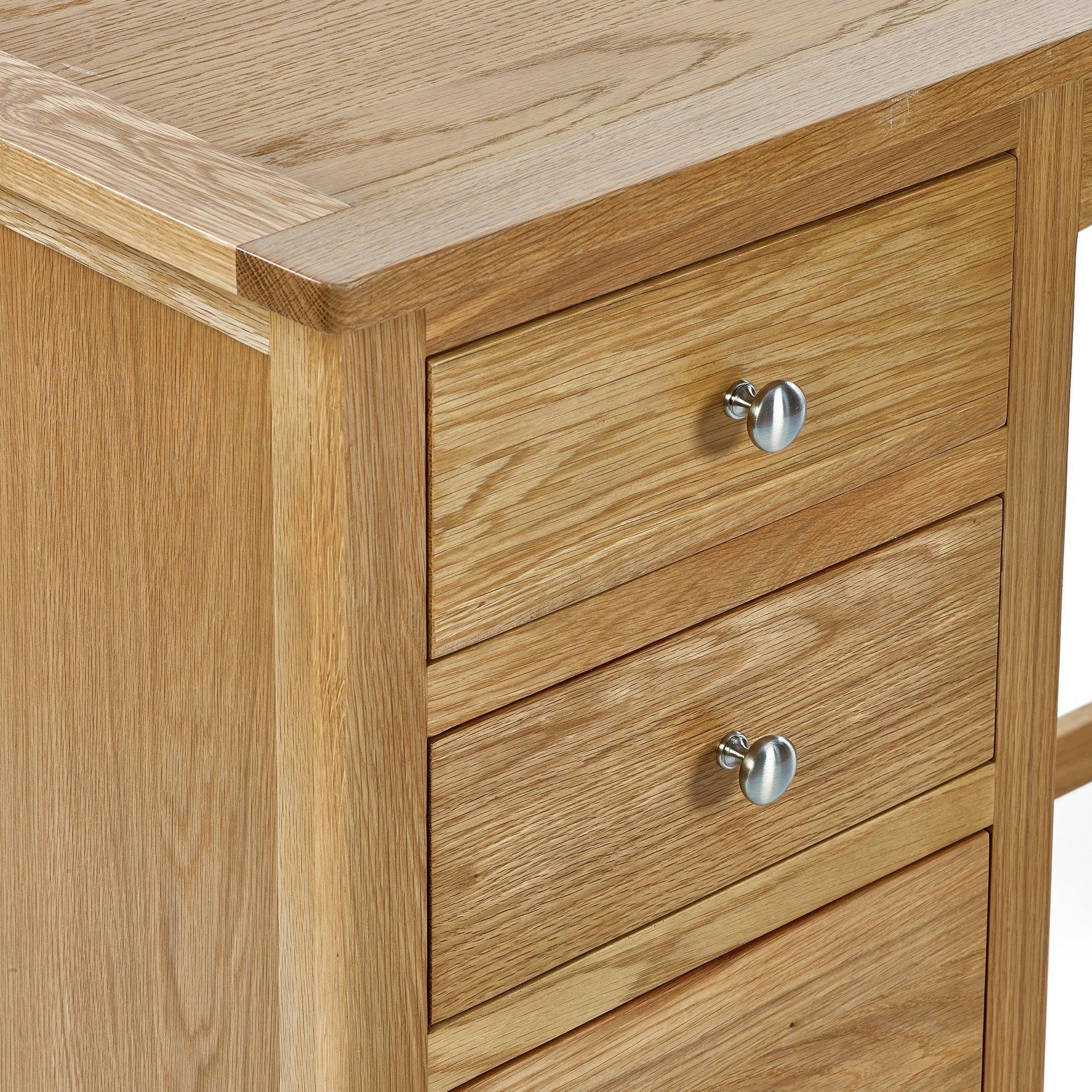 Oak dressing table side detail with three drawers and chrome handles