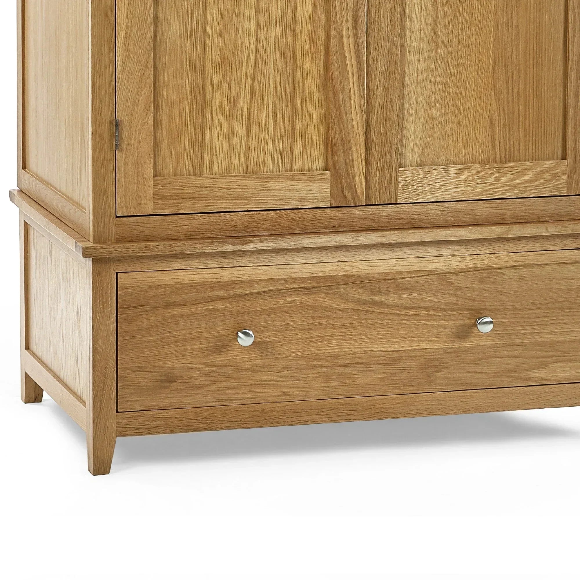 Oak wardrobe bottom detail showing storage drawer with metal handles