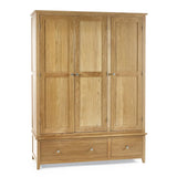 Oak 3 door wardrobe with panelled doors and two bottom drawers, front view