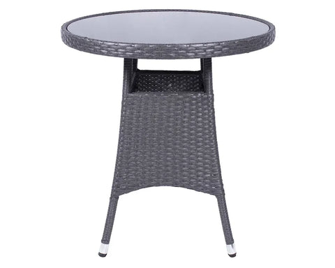 Grey rattan outdoor table with round glass top and open shelf detail