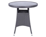 Grey rattan outdoor table with round glass top and open shelf detail