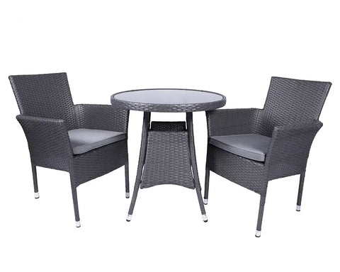 Grey rattan bistro set with round glass table and two cushioned chairs