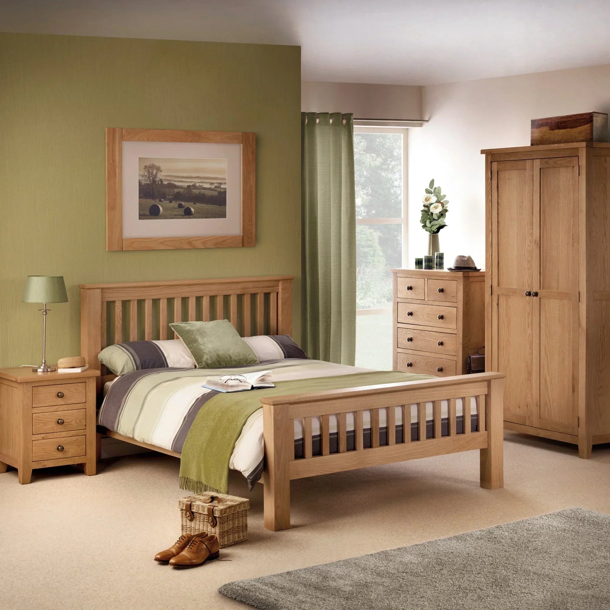 Oak dressing stool at foot of slatted wooden bed with matching wardrobe and drawers
