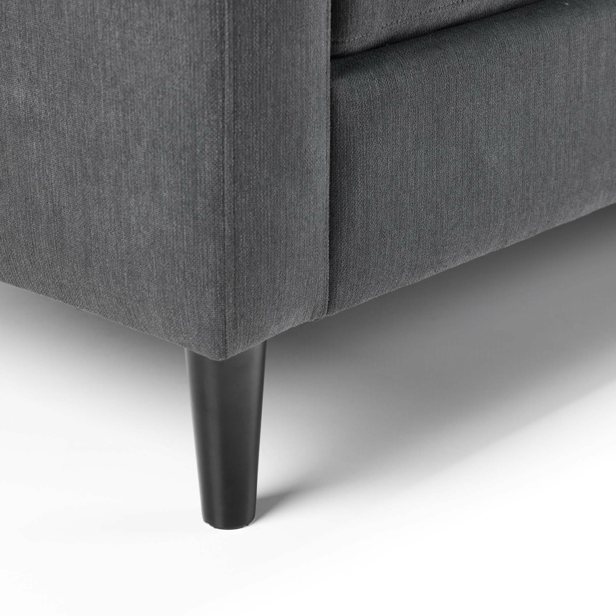 Dark grey corner sofa fabric with black tapered leg, close-up of base detail