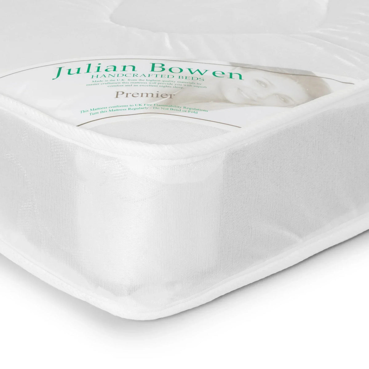 Premier 90cm mattress corner close-up showing white fabric texture and stitched edge