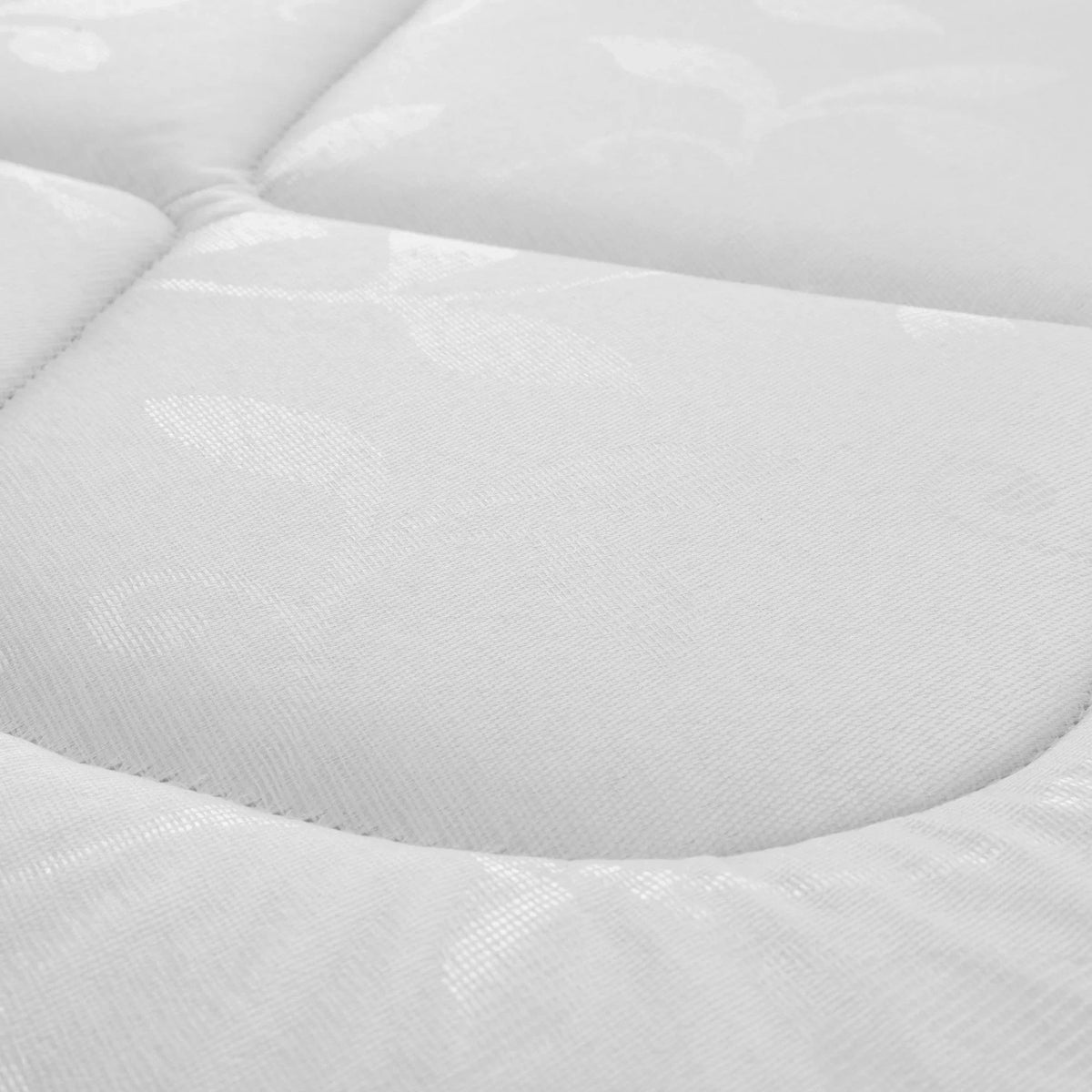 Close-up of Premier 90cm mattress fabric with quilted stitching and subtle leaf pattern