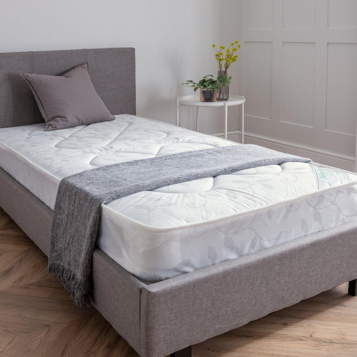 Premier 90cm single mattress on grey upholstered bed in modern bedroom with plants