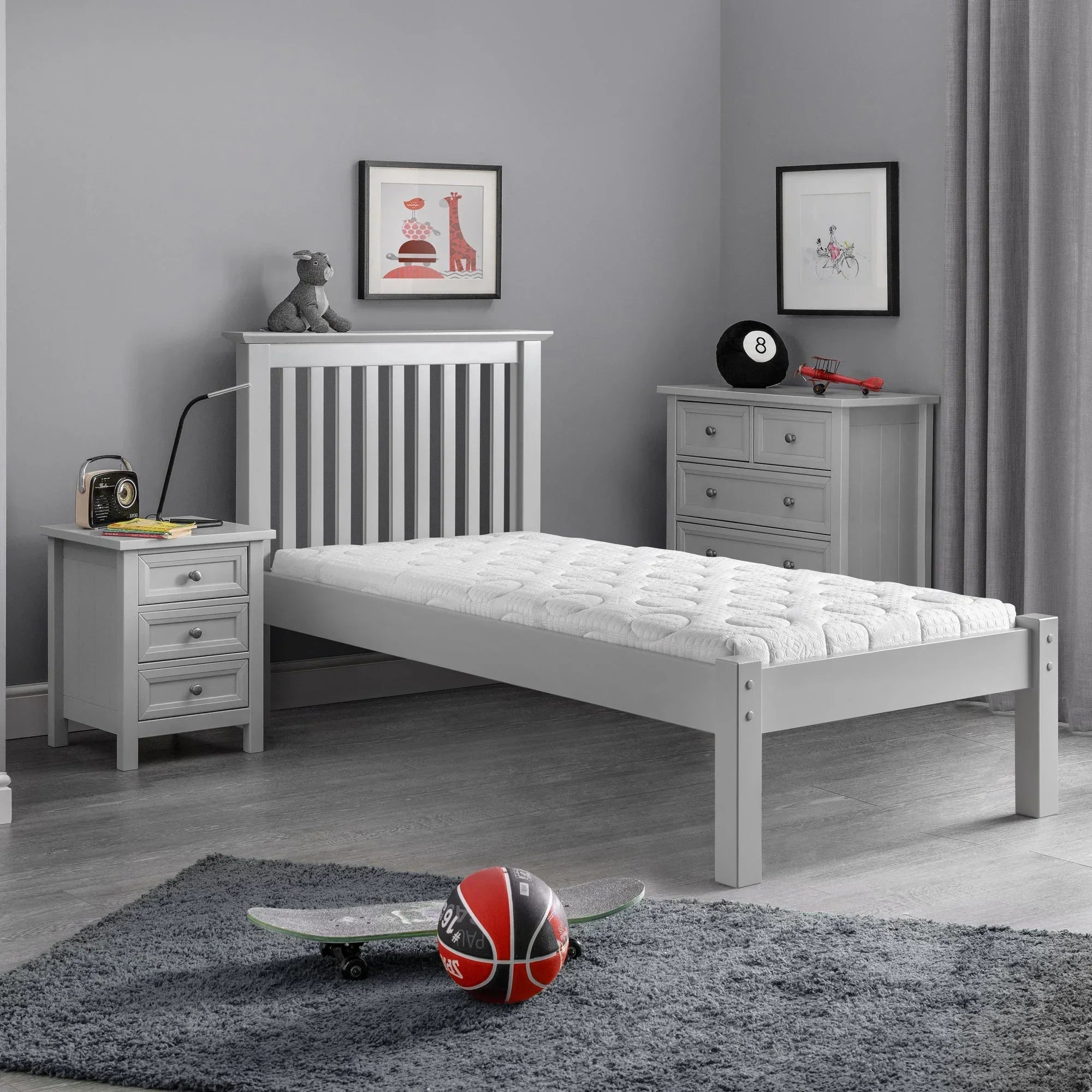 Memory roll-up mattress single size on grey wooden bed in modern kids bedroom