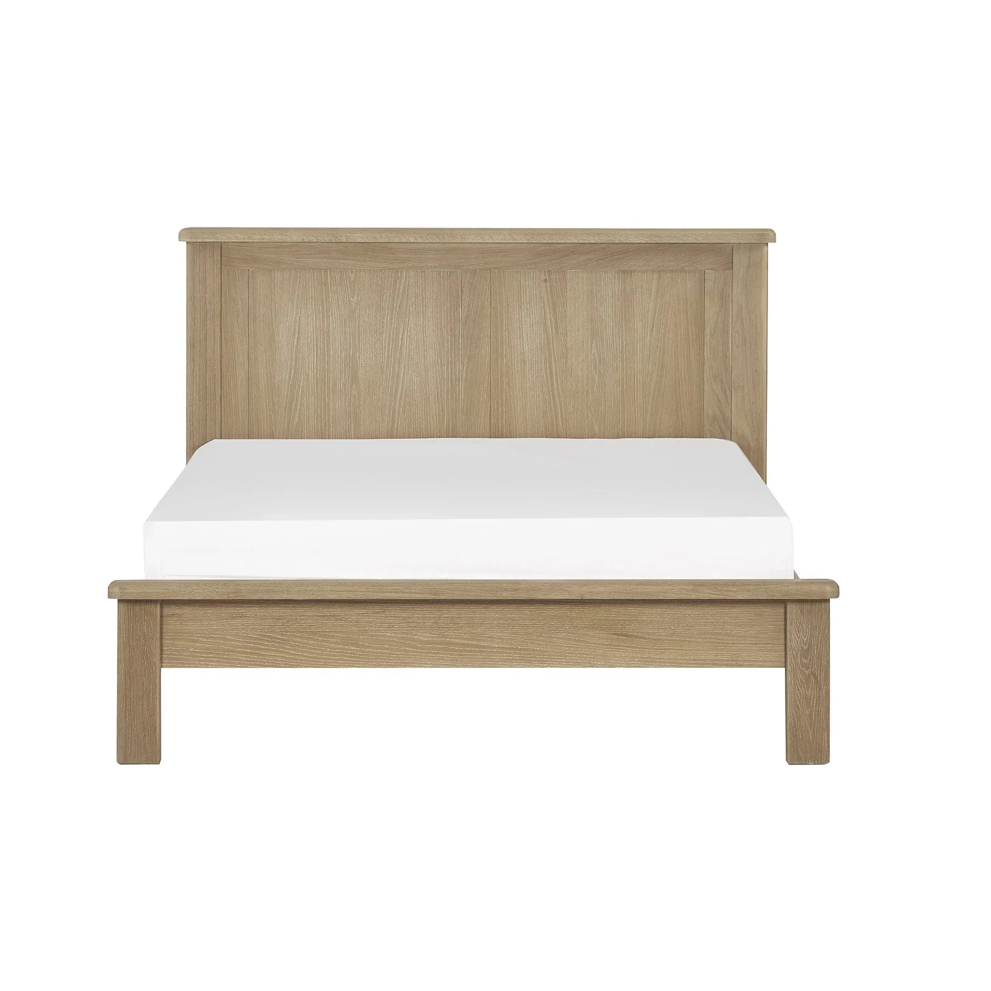 Memphis limed oak bed frame with tall headboard and white mattress, front view