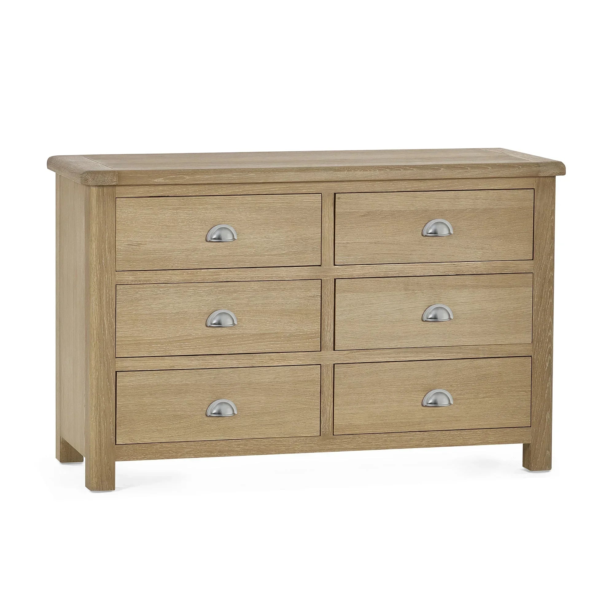 Memphis limed oak six drawer wide chest with metal cup handles, front angle view