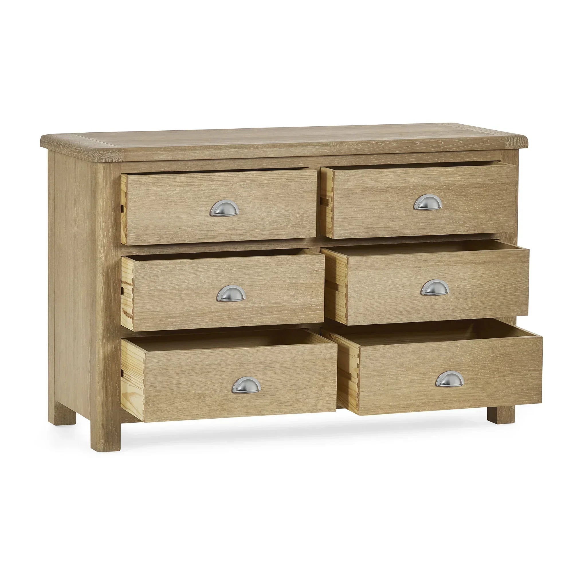 Memphis limed oak 6 drawer wide chest with silver cup handles, drawers partially open