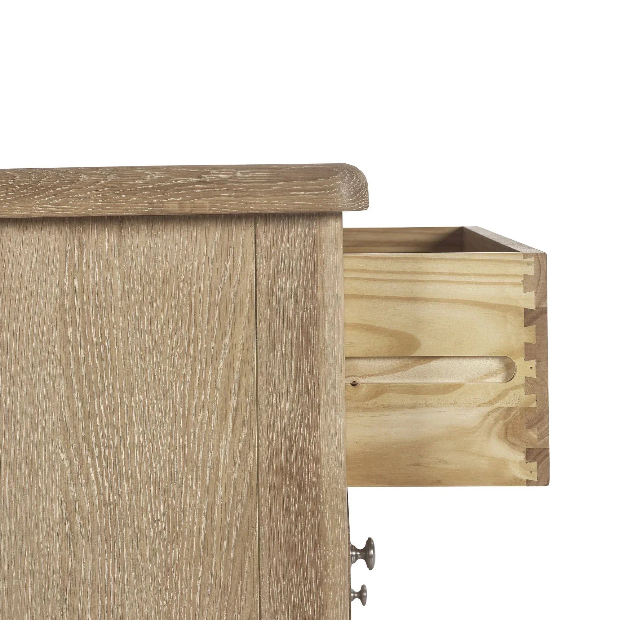 Closeup of Memphis limed oak 6 drawer wide chest with one open drawer showing wood detail
