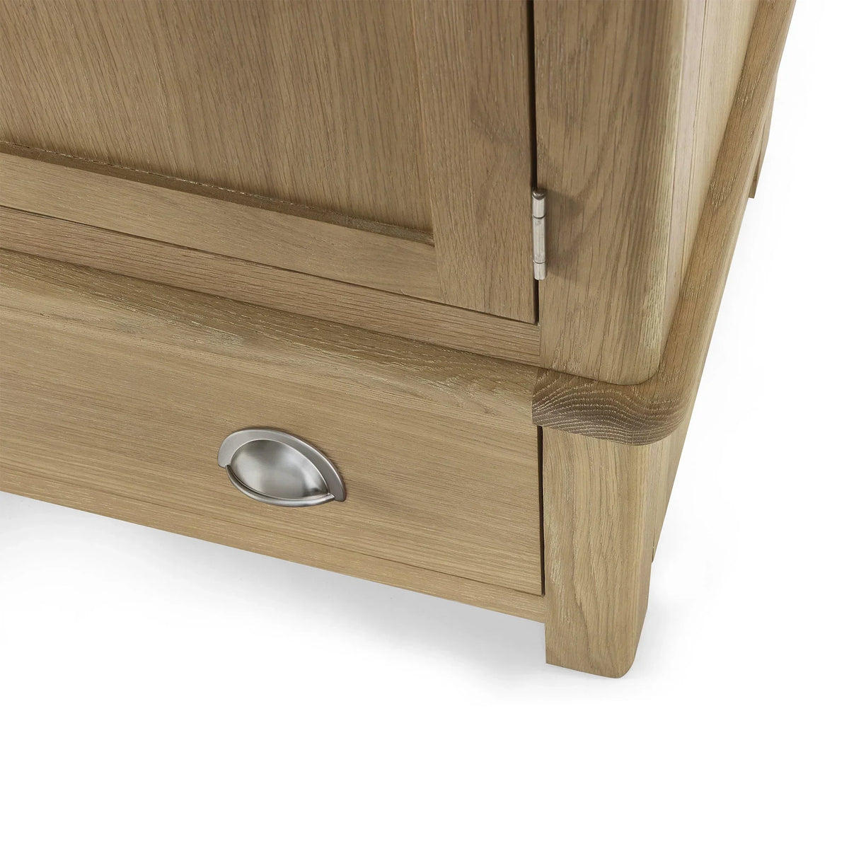 Closeup of Memphis limed oak wardrobe drawer with silver cup handle and wood grain detail