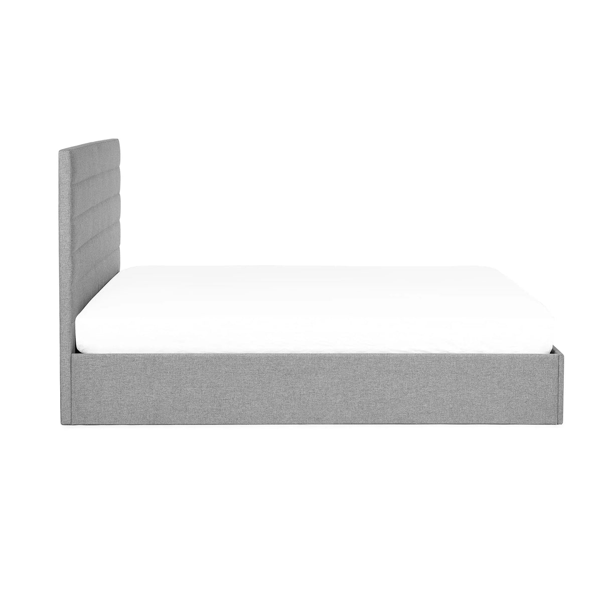 Grey lift-up storage bed with padded headboard and white mattress, side profile view