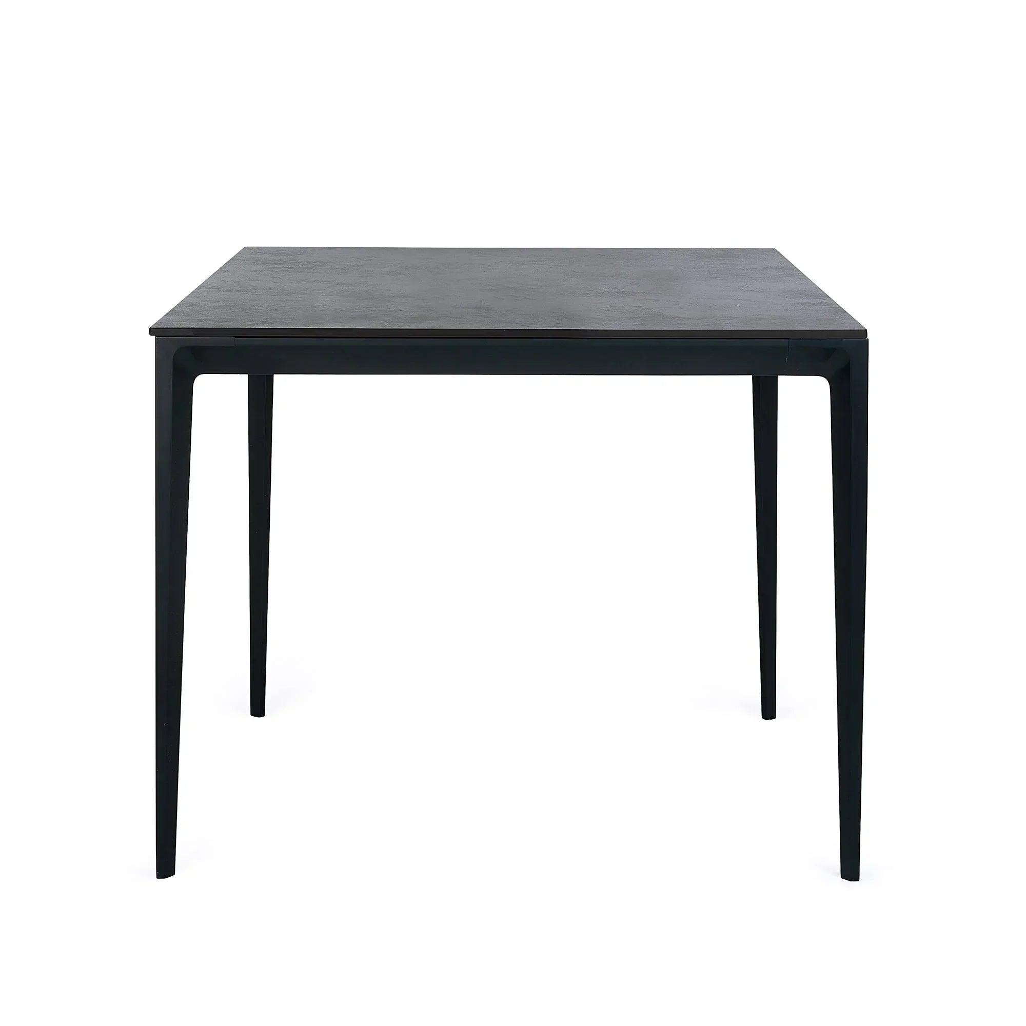 Slate grey square stone top dining table with slim black legs, front angle view