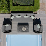 Grey outdoor sofa set with matching armchairs and low table by pool on deck