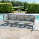Modern outdoor rope garden sofa in grey finish beside swimming pool on patio
