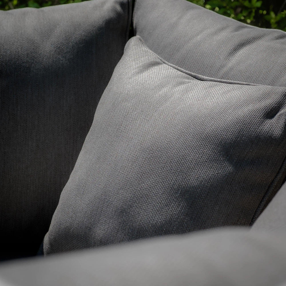 Closeup of dark grey fabric sofa cushions with textured upholstery
