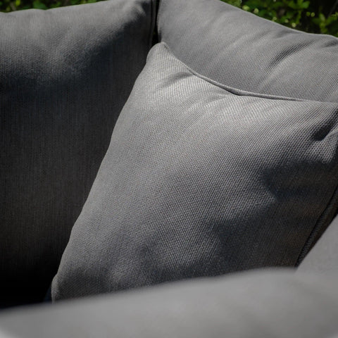Closeup of dark grey fabric sofa cushions with textured upholstery