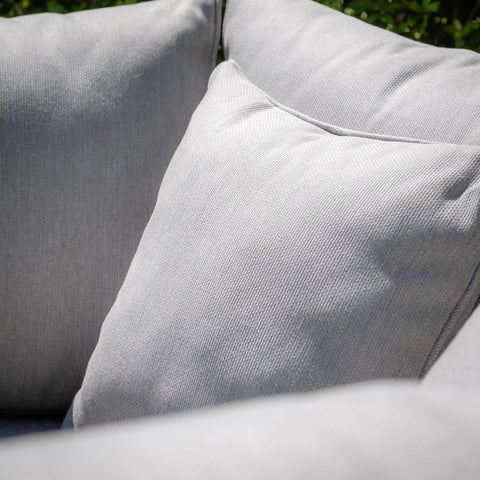 Close up of light grey sofa cushions with textured fabric