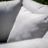 Close up of light grey sofa cushions with textured fabric