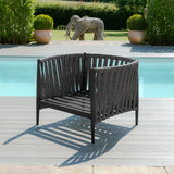 Contemporary black outdoor lounge chair with woven backrest on poolside decking
