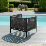 Grey outdoor rope armchair with black frame on poolside decking