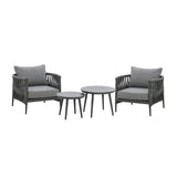 Grey rope armchair garden set with two round tables and cushions on white background