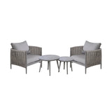Grey garden lounge chair set with rope arms and two round nesting outdoor tables