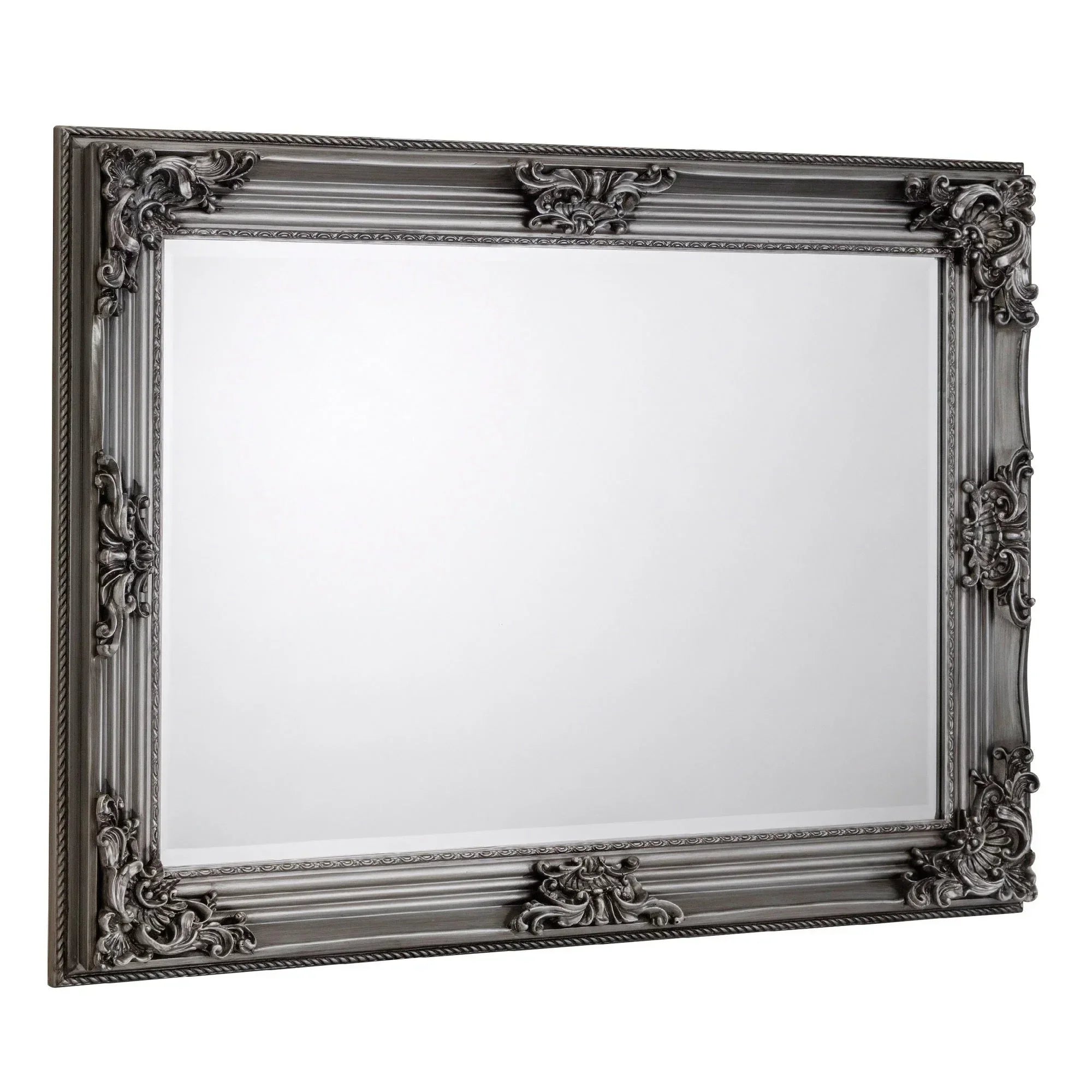 Rectangular pewter wall mirror with ornate Rococo frame detailing, angled side view