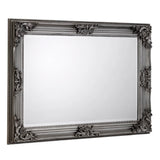 Rectangular pewter wall mirror with ornate Rococo frame detailing, angled side view