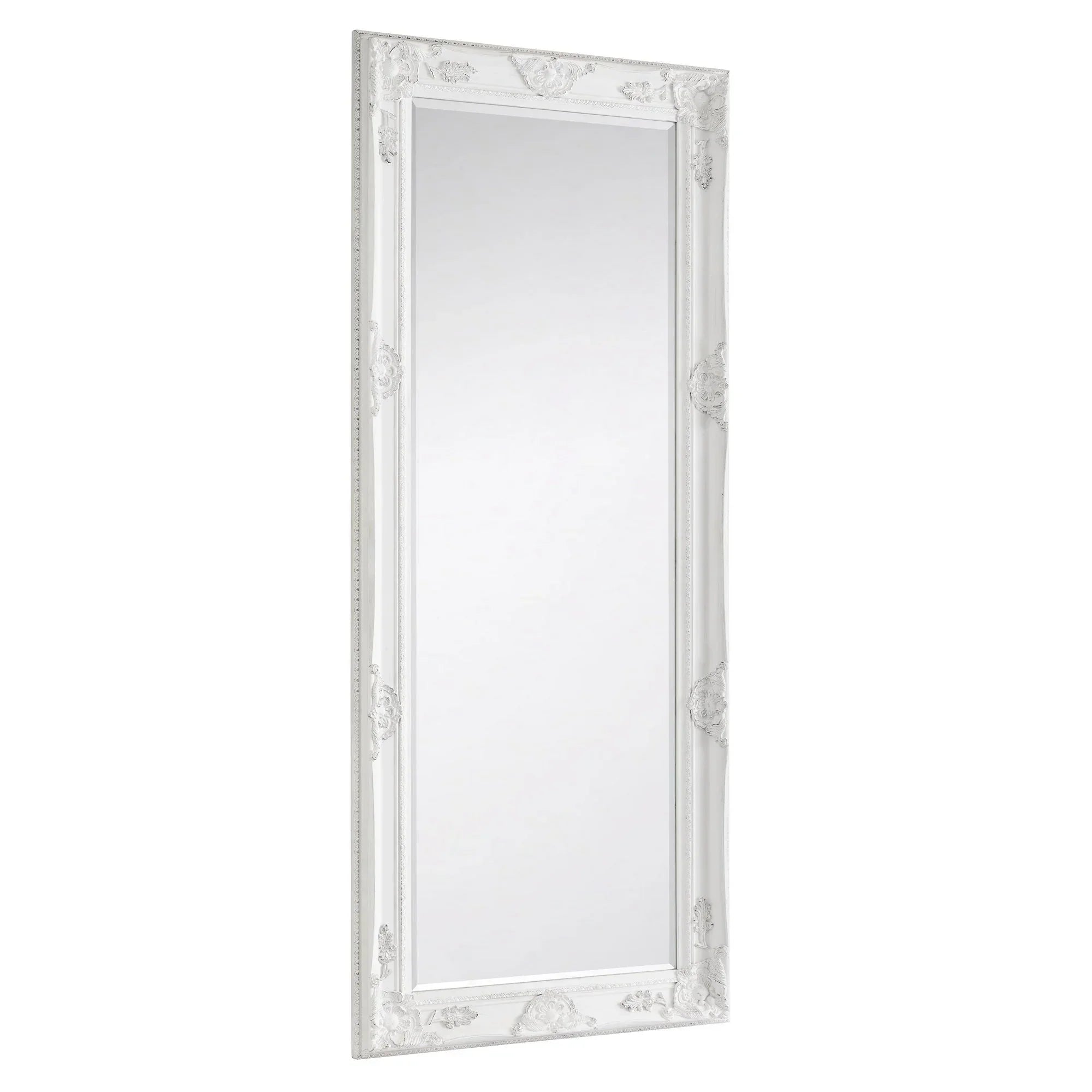 White ornate dress mirror with decorative carved frame, shown at an angled side view