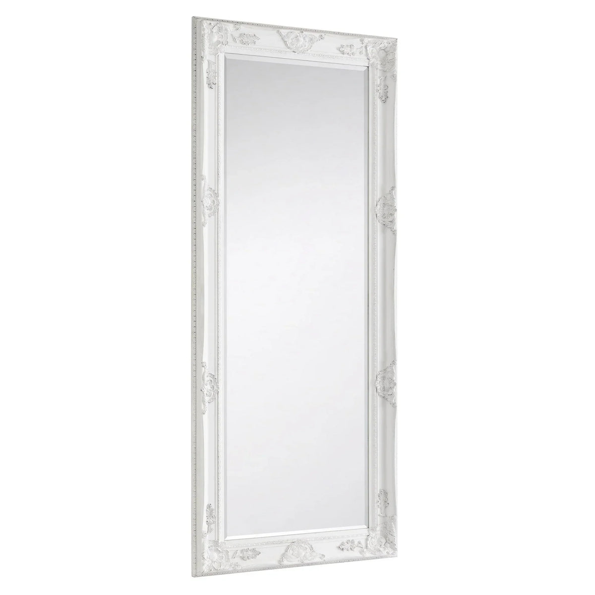 White ornate dress mirror with decorative carved frame, shown at an angled side view
