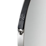 Round wall mirror with metal frame and black leather hanging strap detail close-up