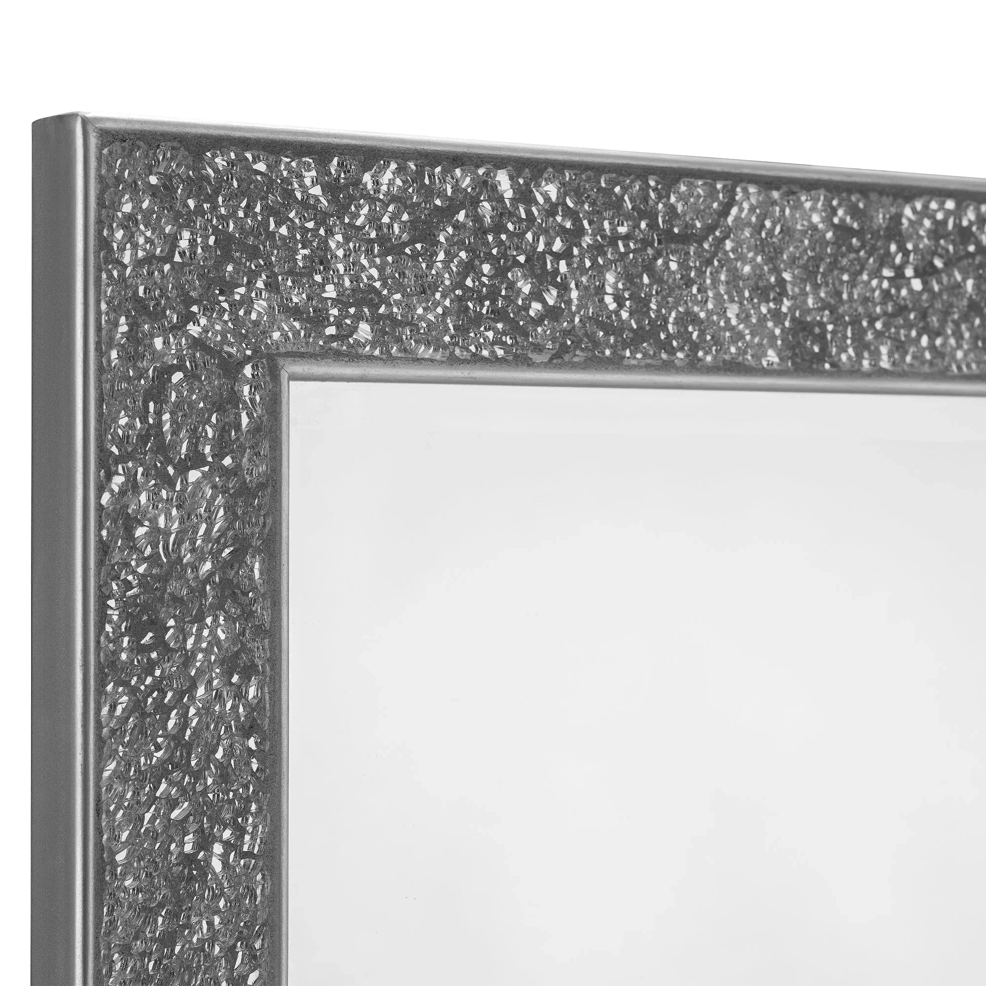 Closeup of wall mirror with textured silver metallic frame and reflective glass surface