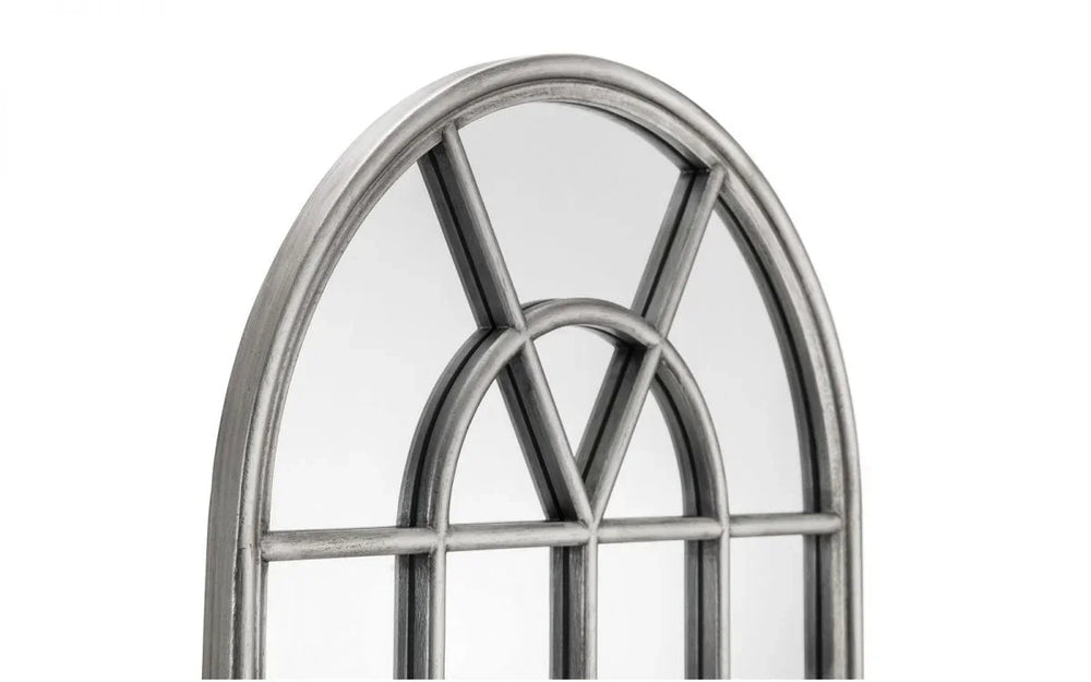 Arched wall mirror with distressed silver metal frame and decorative windowpane design