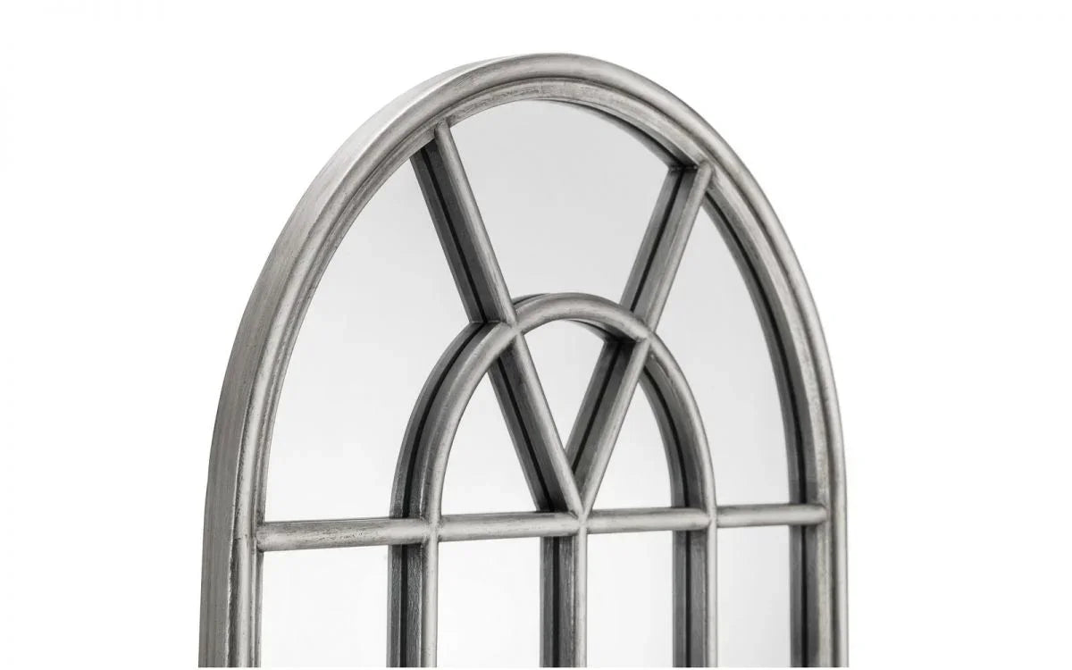 Arched wall mirror with distressed silver metal frame and decorative windowpane design