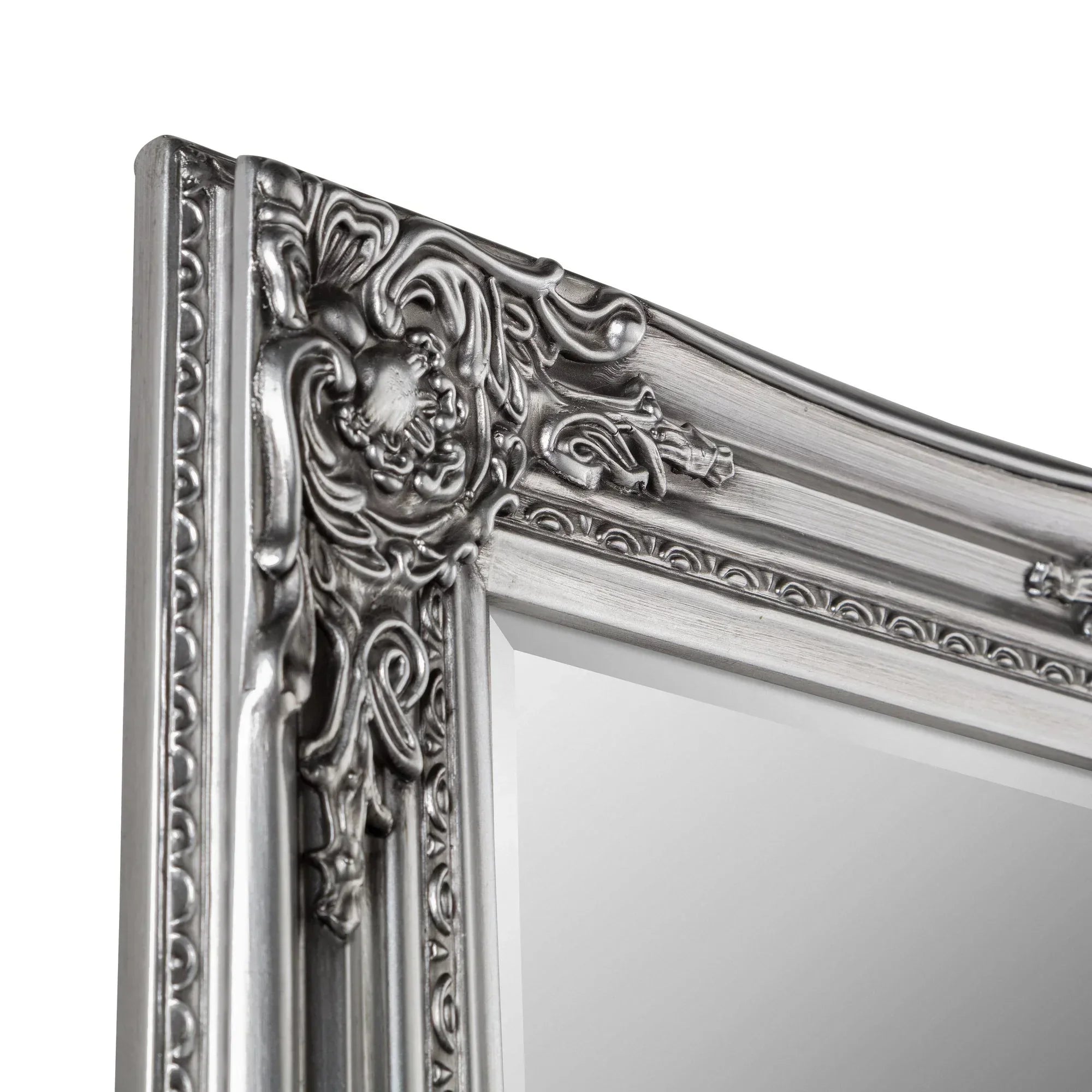 Close-up of pewter dress mirror with ornate, decorative frame detail