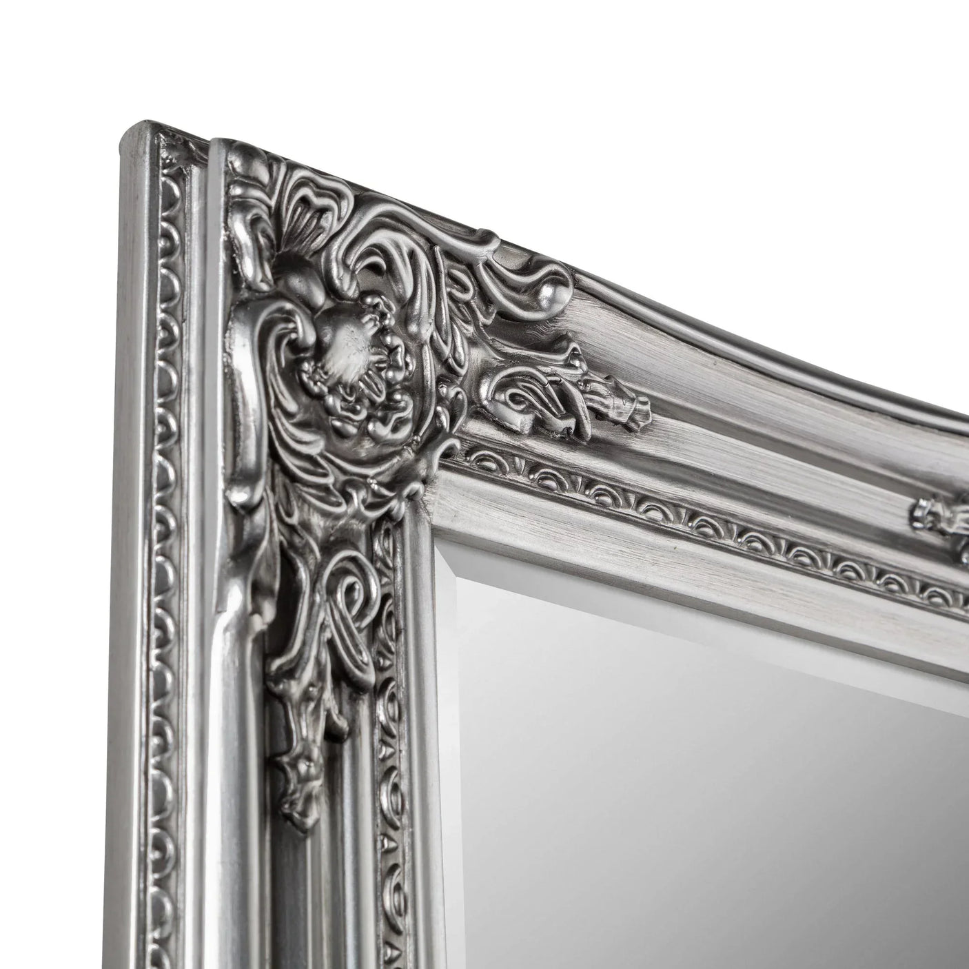Close-up of pewter dress mirror with ornate, decorative frame detail