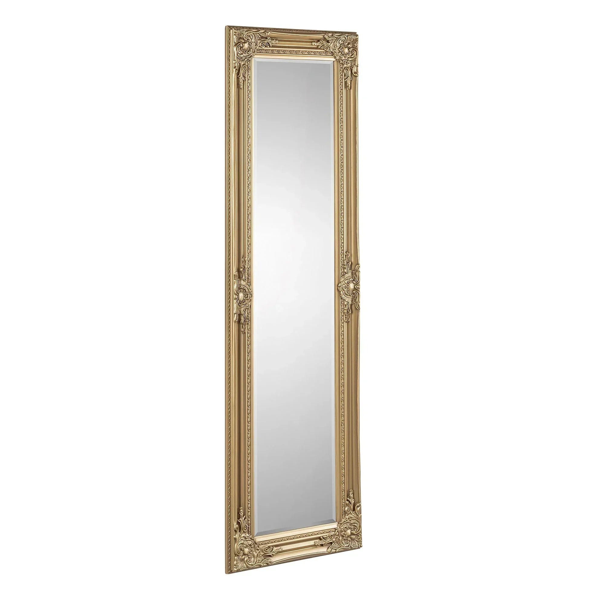 Gold ornate full length mirror with decorative frame leaning against white background