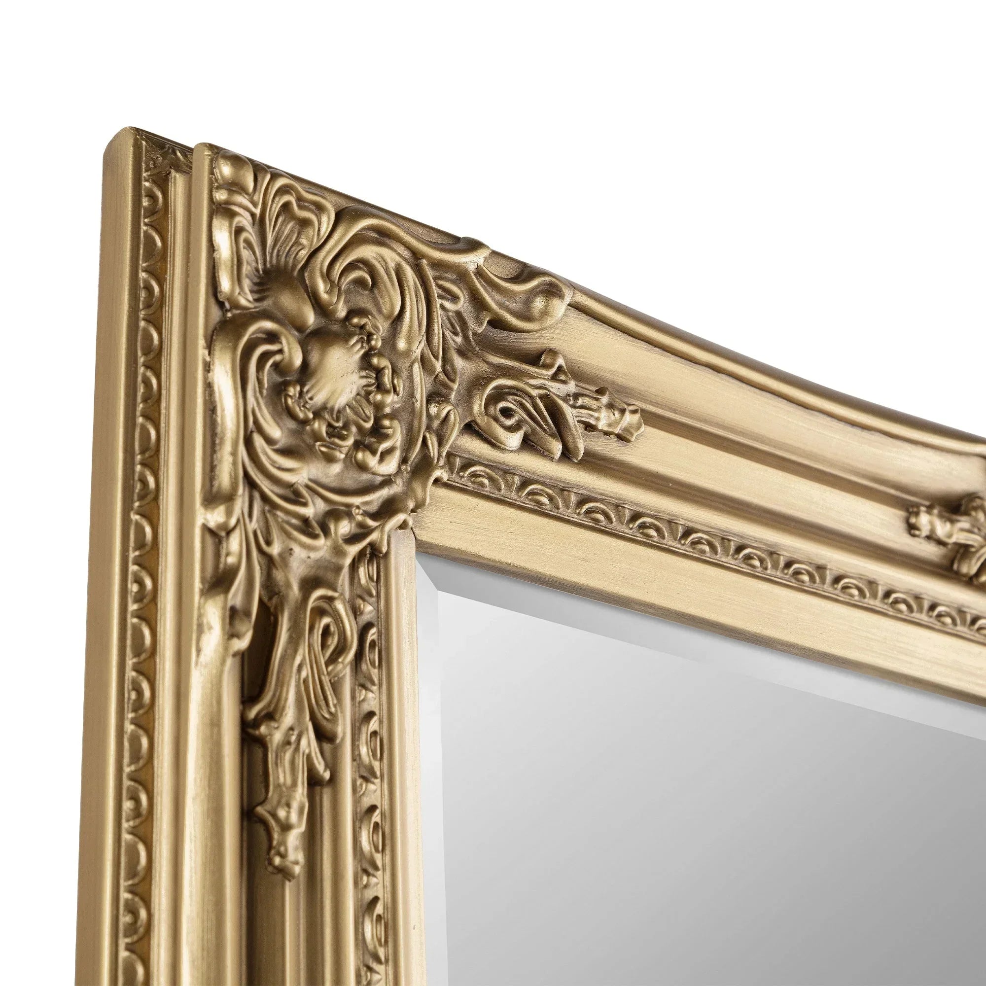 Gold ornate mirror frame with decorative carved detailing, close-up corner view