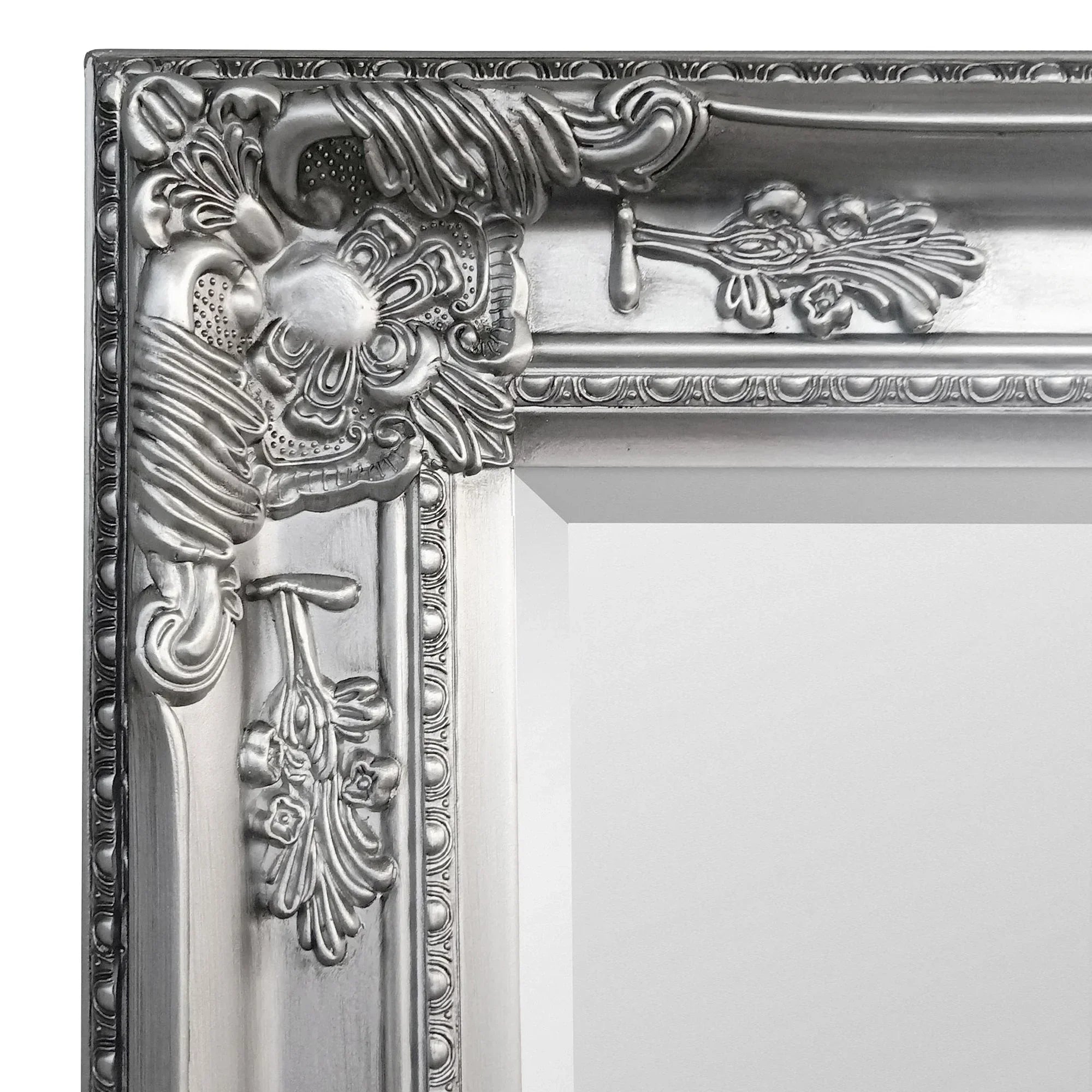 Pewter lean-to dress mirror with ornate floral frame detail and metallic finish close-up