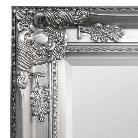 Pewter lean-to dress mirror with ornate floral frame detail and metallic finish close-up