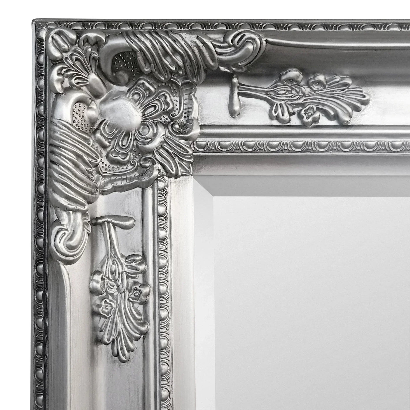 Pewter lean-to dress mirror with ornate floral frame detail and metallic finish close-up