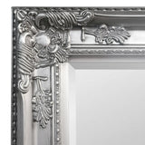 Pewter lean-to dress mirror with ornate floral frame detail and metallic finish close-up
