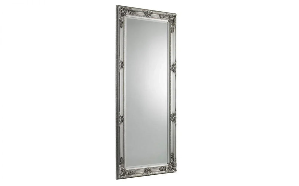 Tall rectangular silver mirror with ornate decorative frame detailing